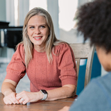 A Safe Families family coach meets with a young father.